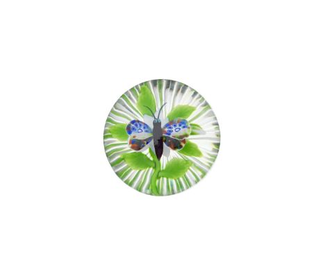A Baccarat white double-clematis and butterfly paperweight, circa 1850The insect with a kaleidoscope of colour on its wings, 