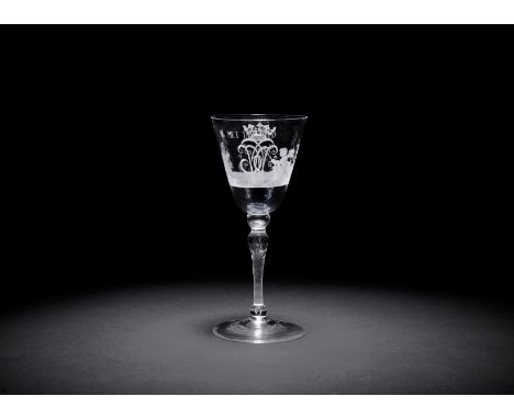 A Dutch engraved light baluster wine goblet, circa 1760The round funnel bowl finely engraved with Cupid fishing on a grassy b
