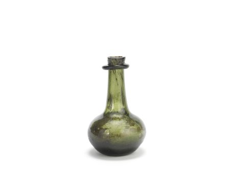 A very rare English quarter-size shaft and globe wine bottle, circa 1660Of attractive small size and olive green tint, with a