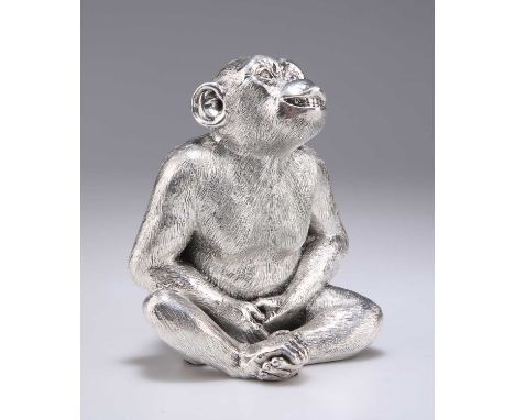 AN ELIZABETH II SILVER MODEL OF A CHIMPANZEE by Camelot Silverware Ltd, Sheffield 2021, the figure sitting, clasping its hand
