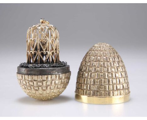 STUART DEVLIN (1931-2018), AN ELIZABETH II SILVER-GILT SURPRISE EGG by Stuart Devlin, London 1981, opening to reveal two love