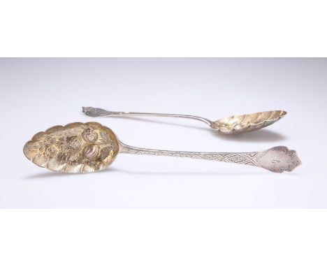 A PAIR OF GEORGE IV SILVER BERRY SPOONS by William Woodman, Exeter 1829, with monogrammed shield-shaped terminals, scroll bac