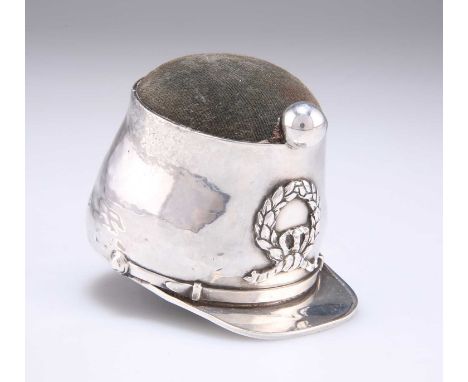 A RARE GEORGE V SILVER NOVELTY PIN-CUSHION by Edward Souter Barnsley, Birmingham 1914, in the form of a Shako. 5.2cm high, 7.