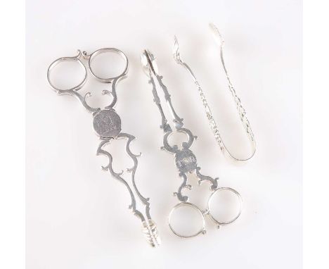 TWO PAIRS OF GEORGIAN SILVER SCISSOR SUGAR NIPS, AND A PAIR OF LATE VICTORIAN SILVER SUGAR TONGS the first by Thomas Wallis I