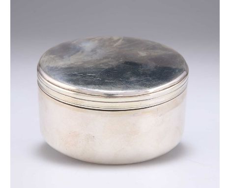 A 19TH CENTURY RUSSIAN SILVER BOX St. Petersburg 1864, plain circular form with screw-down lid and gilded interior. 8.2cm dia