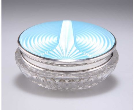 A GEORGE V SILVER AND GUILLOCHÉ ENAMEL-TOPPED GLASS POWDER JAR by Adie Brothers, Birmingham 1913, the squat faceted glass bow