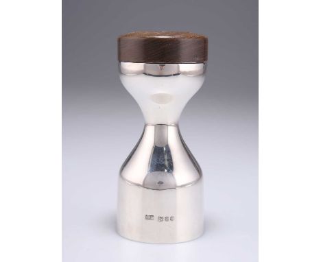 AN ELIZABETH II SILVER AND OAK PEPPER GRINDER by Robert Welch, London 1976, hourglass form, with turned oak top. 13cm high, 1