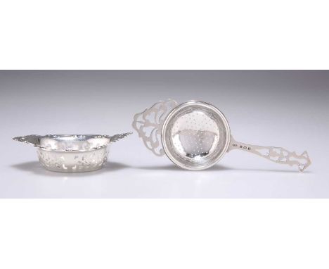 A GEORGE VI SILVER TEA STRAINER by William Suckling Ltd, Birmingham 1940, with foliate pierced handle and lip; together with 