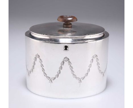 A GEORGE III SILVER TEA CADDY by Abstinando King, London 1800, oval, engraved with bellflower swags. 13cm wide, 12.7 troy oun