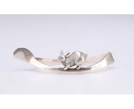 A GEORGE V SILVER NOVELTY NAPKIN RING by G &amp; C Hodgetts, Birmingham 1914, as a wishbone with a rabbit. 6.5cm longLight ge