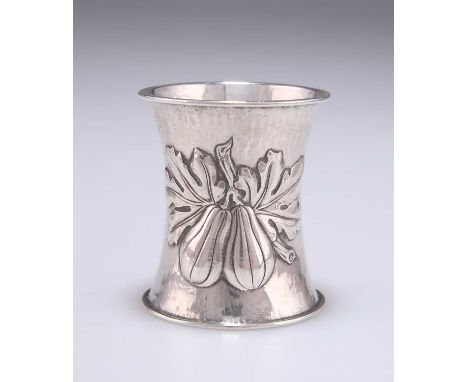 OMAR RAMSDEN: A GEORGE V SILVER NAPKIN RING by Omar Ramsden, London 1910, of waisted form and embossed with a pair of figs an