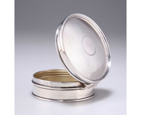 A GEORGE V SILVER POWDER BOX Birmingham 1917, circular form, with hinged engine-turned cover and gilt interior. 3cm high by 8