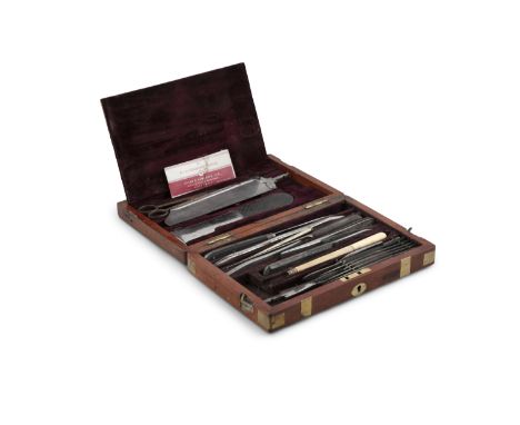 A COMPACT 19TH CENTURY MAHOGANY BRASS MOUNTED SURGEON'S CASE, containing two trays with an extensive range of surgical implem