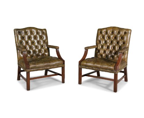 A PAIR OF GEORGIAN STYLE GAINSBOROUGH BUTTON BACK ARMCHAIRS, upholstered in close-nail leather, with mahogany frame, the chan