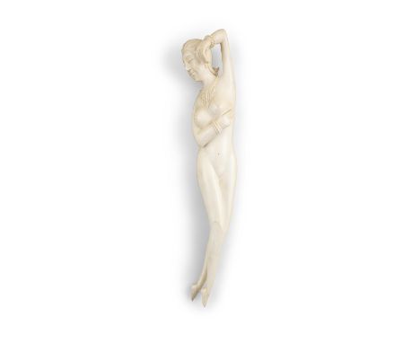 *A CHINESE 19TH CENTURY IVORY CARVING OF A RECLINING LADY, 'DOCTOR'S DIAGNOSTIC DOLL'.  The figure 30.5cm wide; the stand 41c