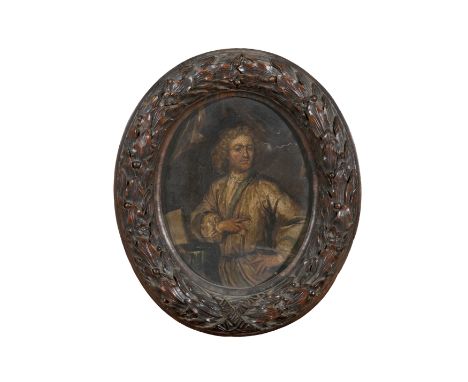 ENGLISH SCHOOL 18TH CENTURY Portrait of a lady and gentleman Oil on copper panels,  ovals within heavy carved leafy frames A 