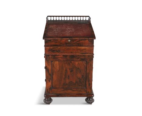 A GEORGE IV ROSEWOOD DAVENPORT DESK, with three quarter gallery, the slope retaining its original red morocco surface and ris