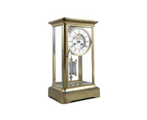AN EDWARDIAN BRASS CASED TALL MANTLE CLOCK, with white enamel dial, striking movement and with mercury twin-tube pendulum. 24