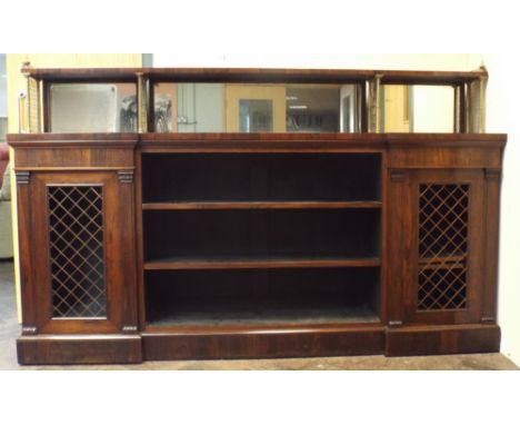 Regency Rosewood break front bookcase fitted open centre and two gilled doors with shelf and mitered back with brass grills a