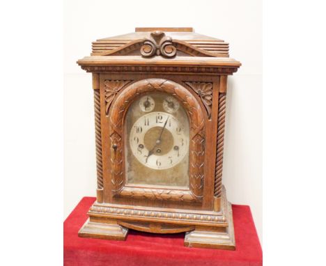 A late Victorian chiming bracket clock in carved oak case with brass and silver dial, overall height 19", 14" wide 