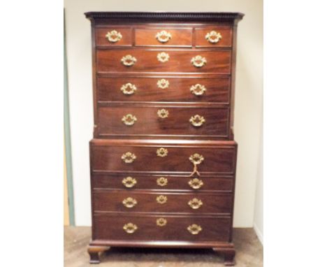 A Georgian mahogany secretaire chest on chest, top section with three long and three short drawers, the bottom section secret