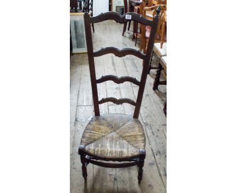 A French oak high ladder back chair with rush seat