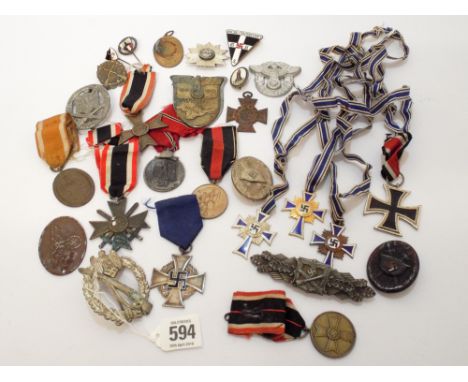 A large collection of German Nazi regalia to include the Iron Cross 2nd class, Mothers Crosses in bronze, silver and gold, th