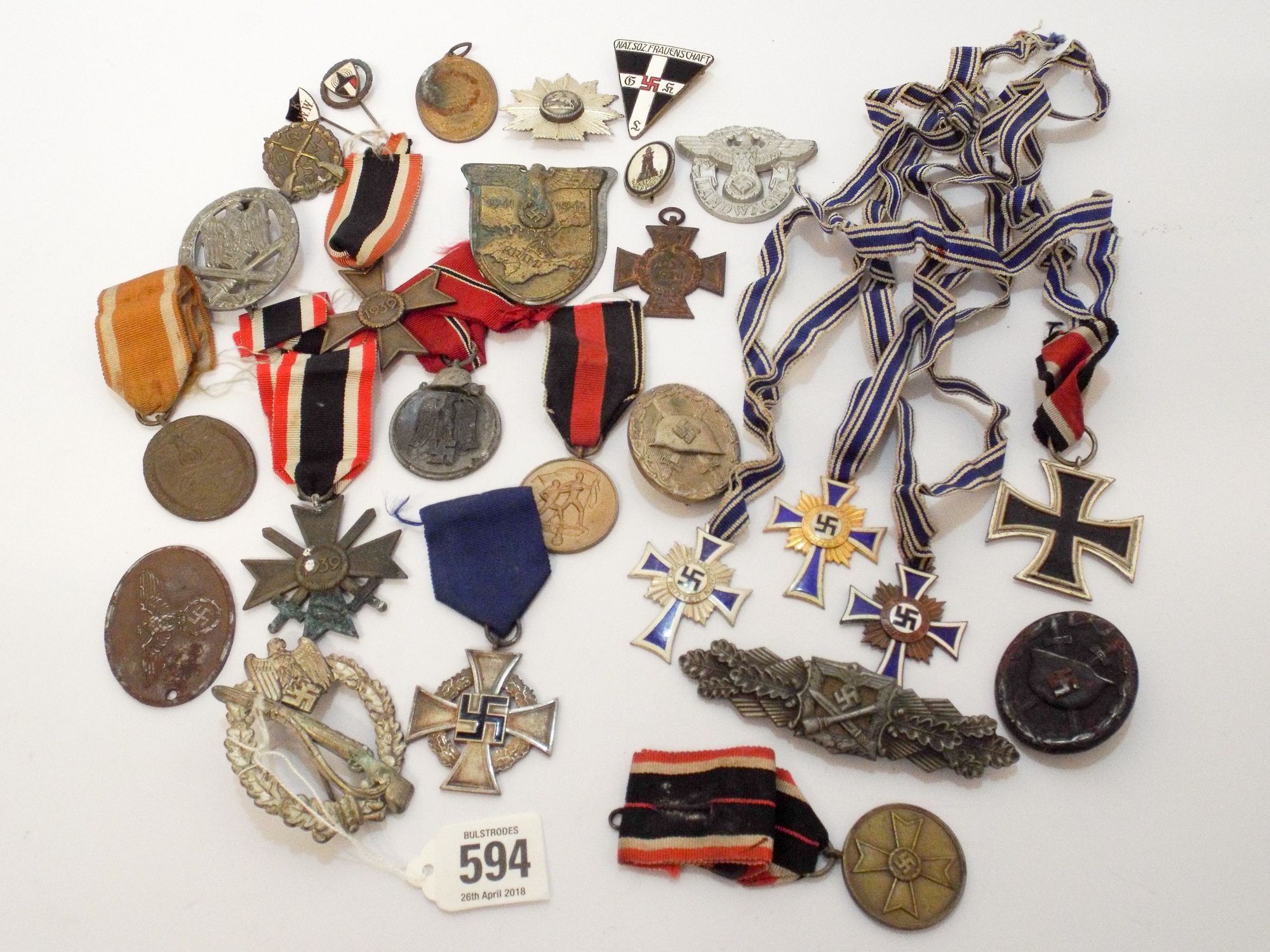 A large collection of German Nazi regalia to include the Iron Cross 2nd ...