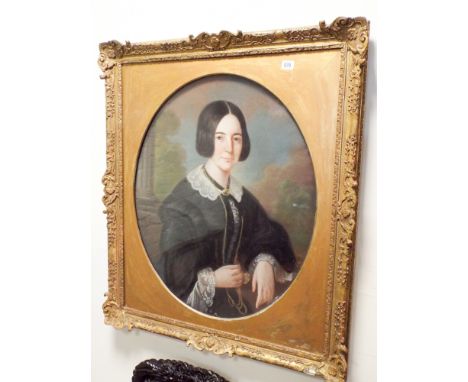 A 19th Century portrait of a lady set in an ornate frame   Oval - 74cm by 61cm 
