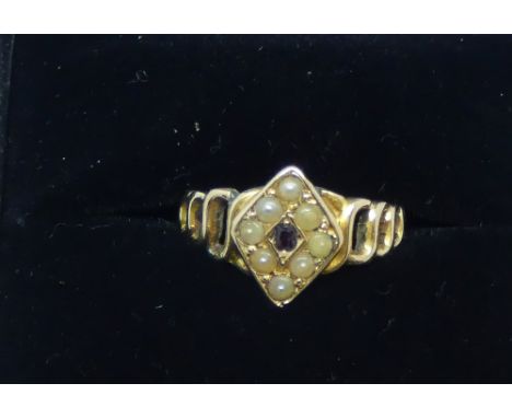 Victorian 15ct gold garnet and seed ring, of a diamond shaped gem set panel on open work twist shank, ring size K