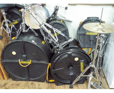 A large extensive drum kit, ELX Pearl, in bright blue,  including 6 drums, five hard cases, a cymbal hard case with three cym