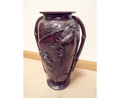 A large Japanese bronze two handled vase or umbrella stand, decorated with birds and bamboo  Height 24.5 inches 