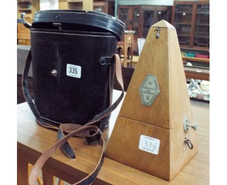 A pair of Lieberman & Gortz 7x50 binoculars in case and a metronome 