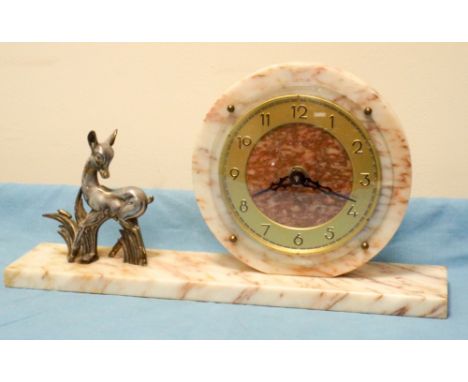 A French circular mantle clock on marble stand with metal faun mount