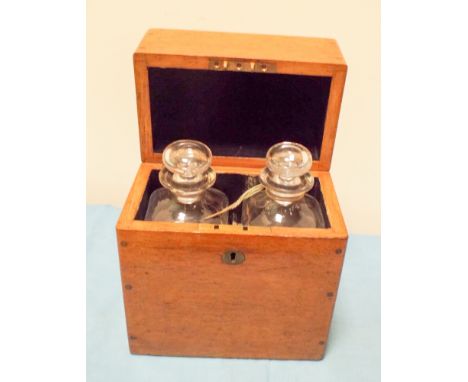 A Victorian light oak decanter box with two square glass decanters 