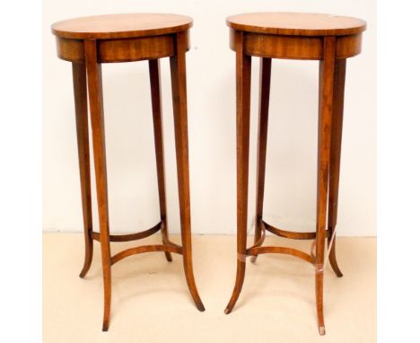 A pair of early 20th century oval satinwood lamp tables or plant stands approx 12" x 10"   Fairly steady, old repair to conca