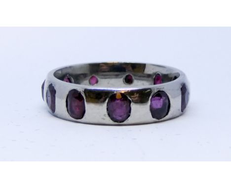 Hand made ruby eternity ring, eleven rubies set in palladium, ring size N