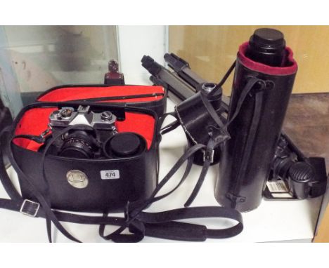 A Fujica 35mm camera and a quantity of assorted accessories including tripod telephoto lenses etc 