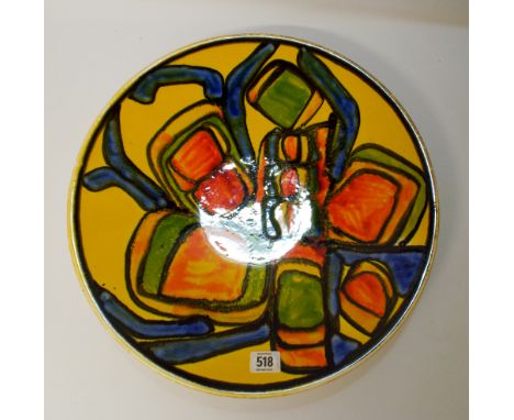 A large Poole Delphis charger approximately 41cms across marked Poole England 54 on the back      There are no visible signs 