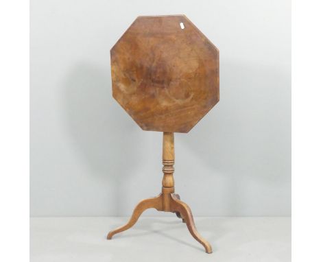 A 19th century mahogany and satinwood-strung octagonal tilt-top occasional table on tripod base. Dimensions as table 50x71cm.