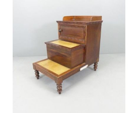An antique mahogany step commode, with inset leather panels. 50x78x76cm. Fair used condition. Middle drawer pulls forward and