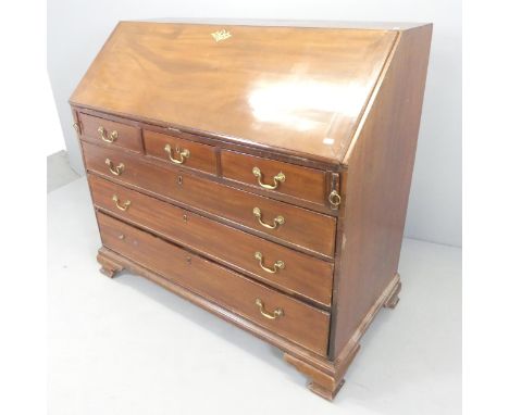 A Georgian mahogany bureau, the fall-front revealing a fitted interior with three short and three long drawers below. 124x107