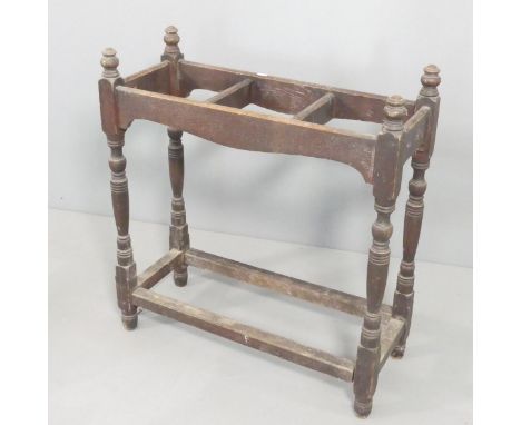 An antique oak umbrella / stick stand. 69x75x28cm. Used condition. Dowel broken to the end of one stretcher. Would benefit fr