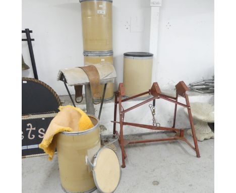 A barber's chair draw down horse saddle stand, with rise and fall mechanism, another draw-down stand, and four containers of 