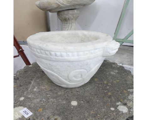 A marble basin/font with carved snake and dog decoration. 38x19cm.