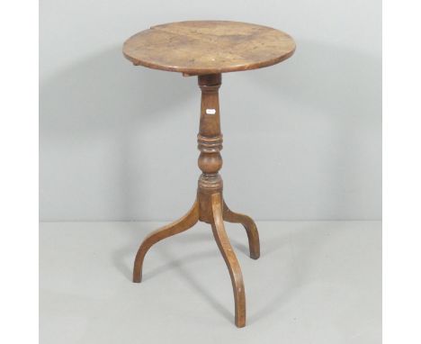 An antique walnut circular tilt-top occasional table on mahogany tripod base. Dimensions as table 46x74cm. Large split to top