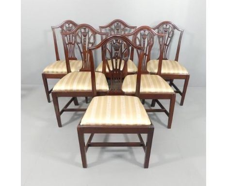 A set of six mahogany Chippendale-style dining chairs, with upholstered drop-in seats.