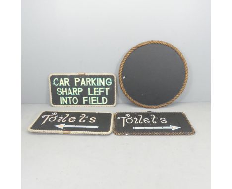 Four various black painted signs with rope surrounds. Diameter of circular sign 88cm. 2x"toilets", 1x"car parking sharp left 