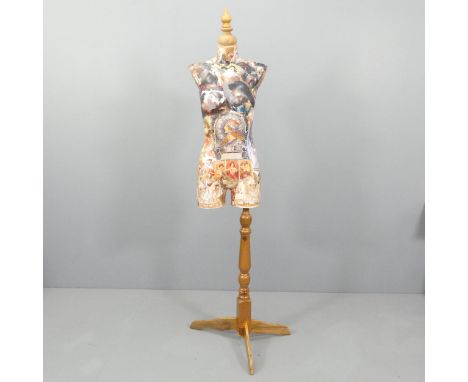 CLIVE FREDRIKSSON - a decoupage decorated mannequin of the female form on pine tripod stand, height 170cm