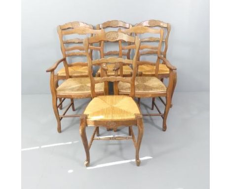 A set of six French oak ladder-back rush seated dining chairs (4+2).